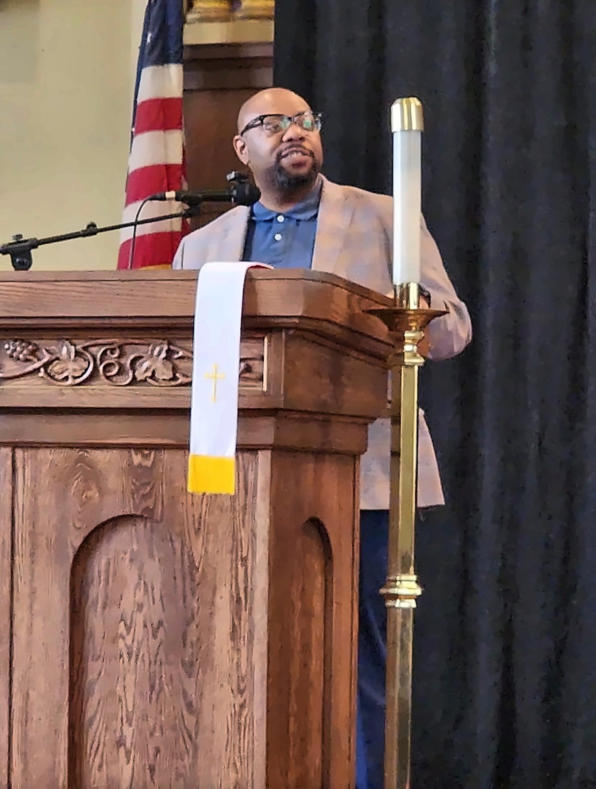 Kermit Williams speaking at a church pulpit